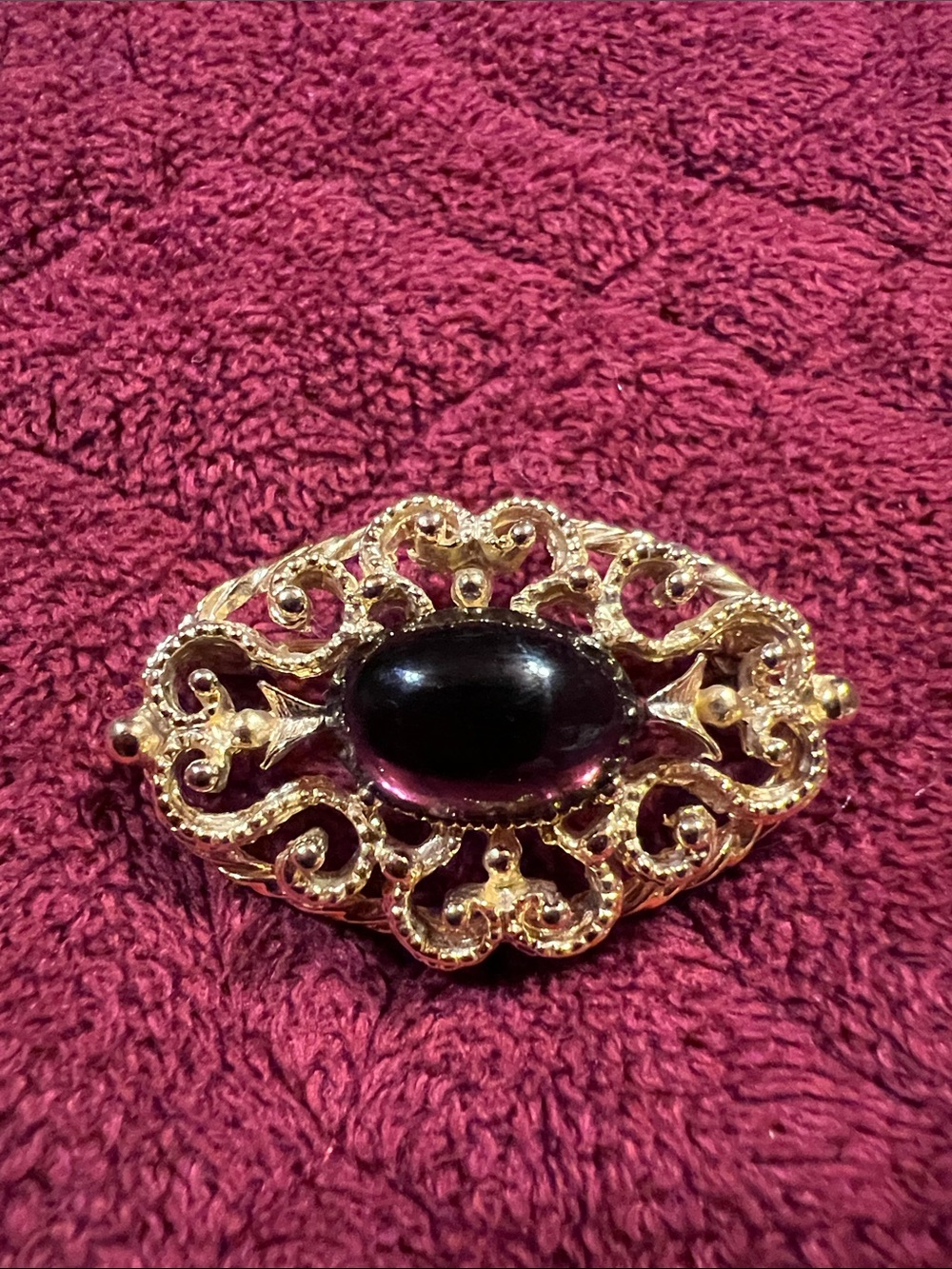 Gold tone Brooch with Deep Purple Cabochon